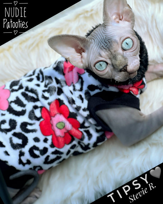 Sphynx cat wearing Fleurs & Fur minky shirt with pink floral leopard print and soft black faux-fur collar